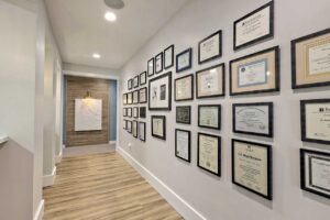 Jones copeland smiles new facility wall of certificates